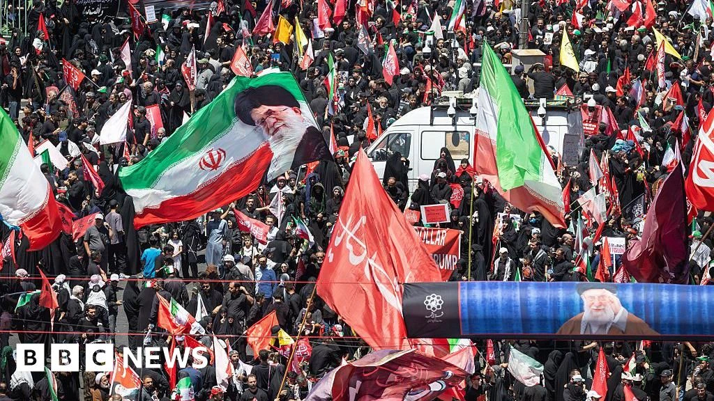 Huge crowds in Mashhad as Iran's late supreme leader is buried